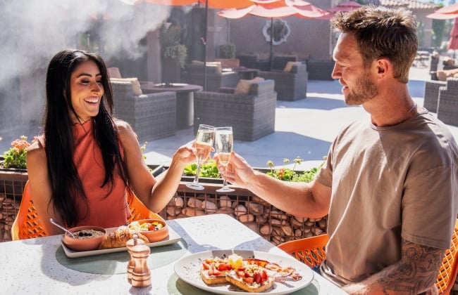 Couple enjoying Garden Court patio dining option